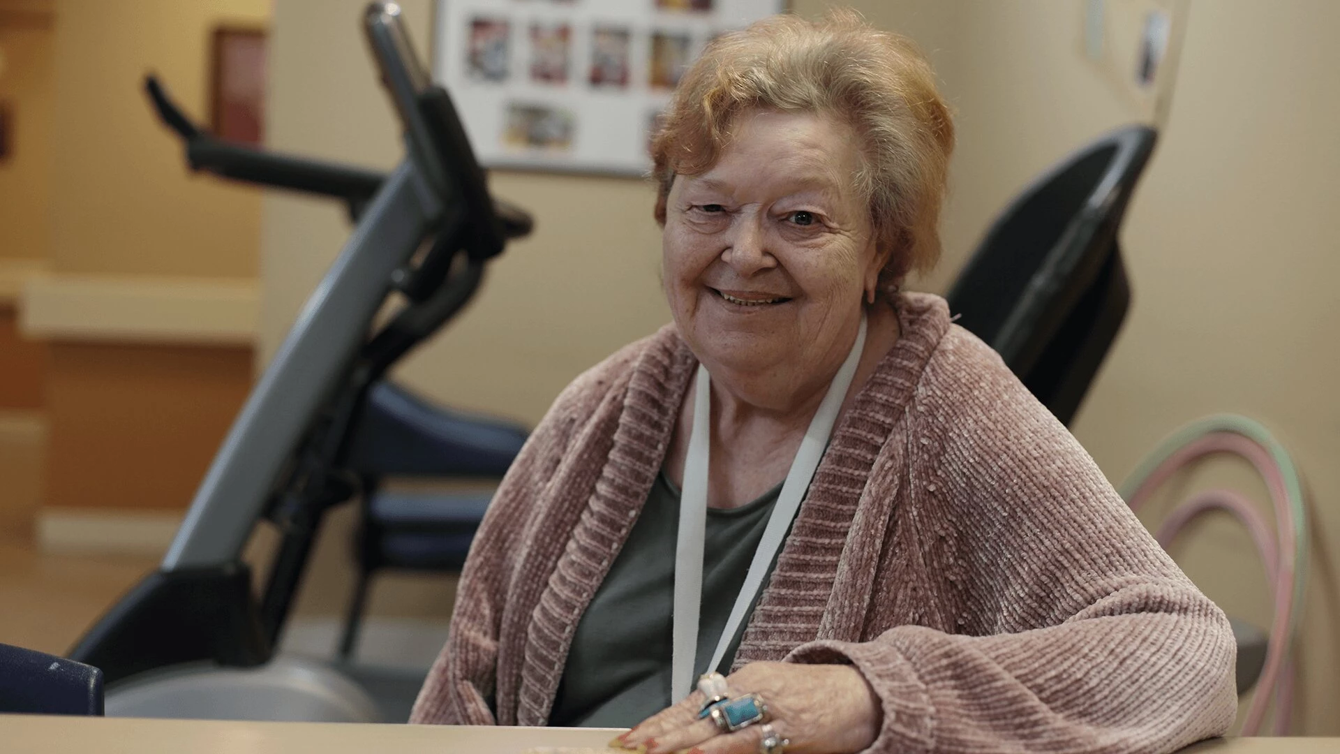 A happy elderly lady inside gym at WHM